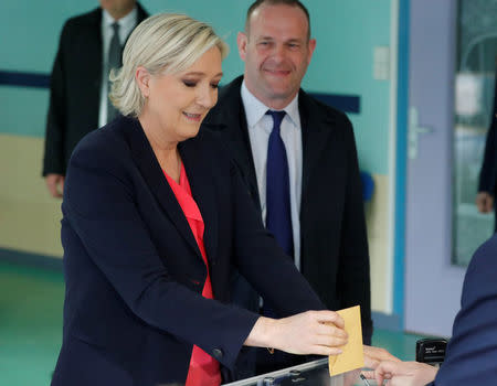 Marine Le Pen, French National Front (FN) political party candidate for French 2017 presidential election, casts her ballot in the second round of 2017 French presidential election at a polling station in Henin-Beaumont, France, May 7, 2017. REUTERS/Charles Platiau