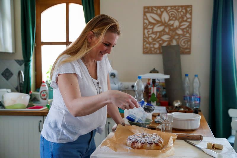 Eszter Harmath prepares a cake at home, during COVID-19 pandemic, in Szentendre