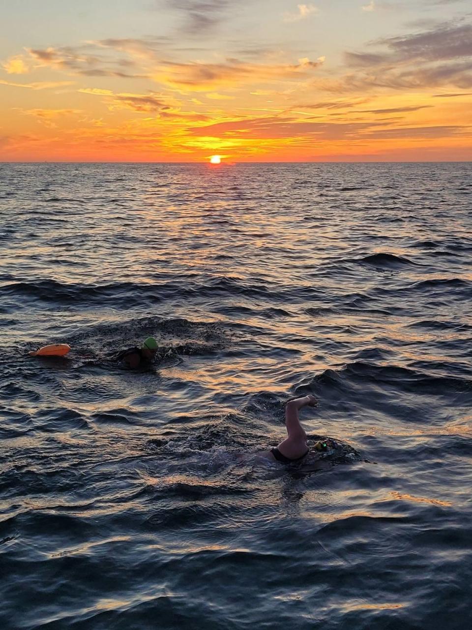 Molly, at right, and Kay Sanborn swim together in the English Channel shortly after sunrise last Wednesday morning.