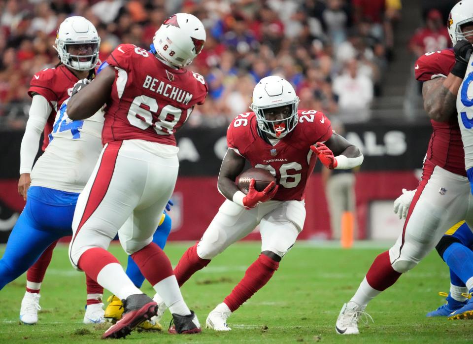 Sep 25, 2022; Glendale, Ariz., U.S.;  Arizona Cardinals running back Eno Benjamin (26) runs the ball against the Los Angeles Rams during the fourth quarter at State Farm Stadium.