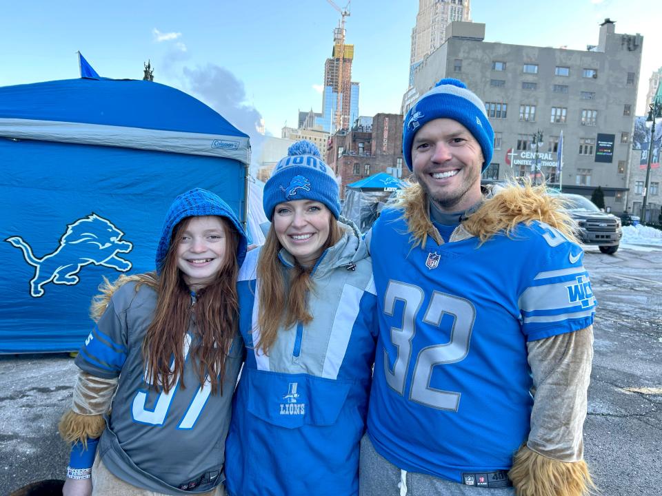 Shawn Rowden, 36, of Linden, right, tailgates with his wife, Jessica, and son, Rory, ahead of the Lions’ playoff game against the L.A. Rams on Sunday, Jan. 14, 2024.