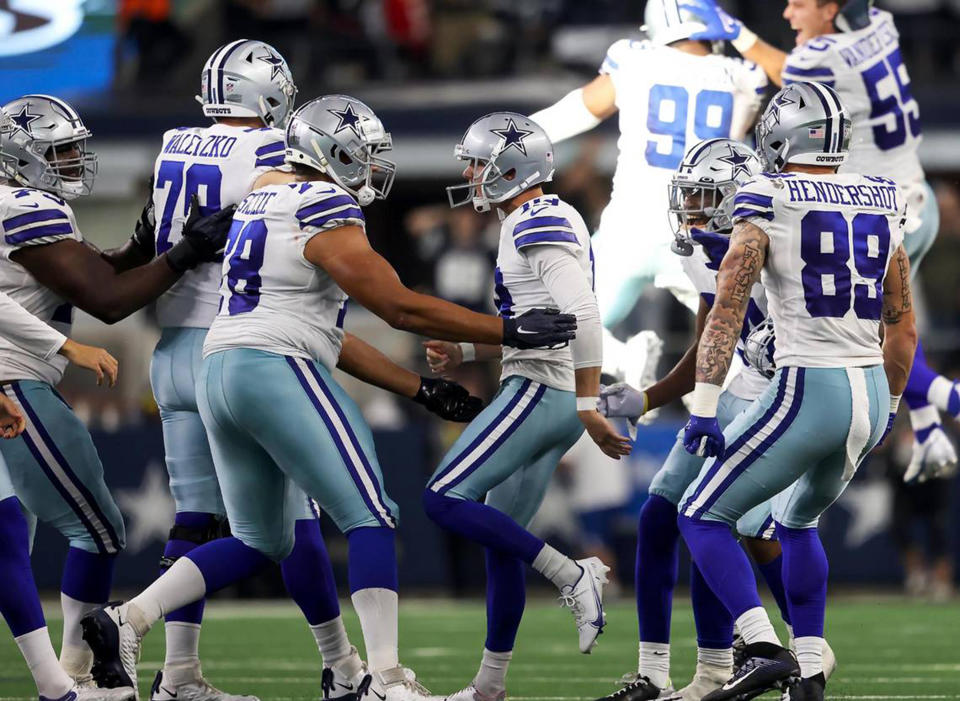 Teammates rush kicker Brett Maher after he kicked a field goal in the fourth quarter to win the game for the Dallas Cowboys over the Cincinnati Bengals on Sunday, Sept. 18, 2022, at AT&T Stadium in Arlington, Texas. (Amanda McCoy/Fort Worth Star-Telegram/Tribune News Service via Getty Images)