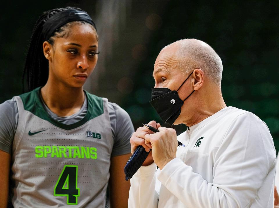 MSU women's basketball associate head coach Dean Lockwood  talks to Alisia Smith during a game against Northwestern on Sunday, Jan. 16, 2022. Lockwood served as acting head coach for Spartans with coach Suzy Merchant out due to COVID-19 health and safety protocols.