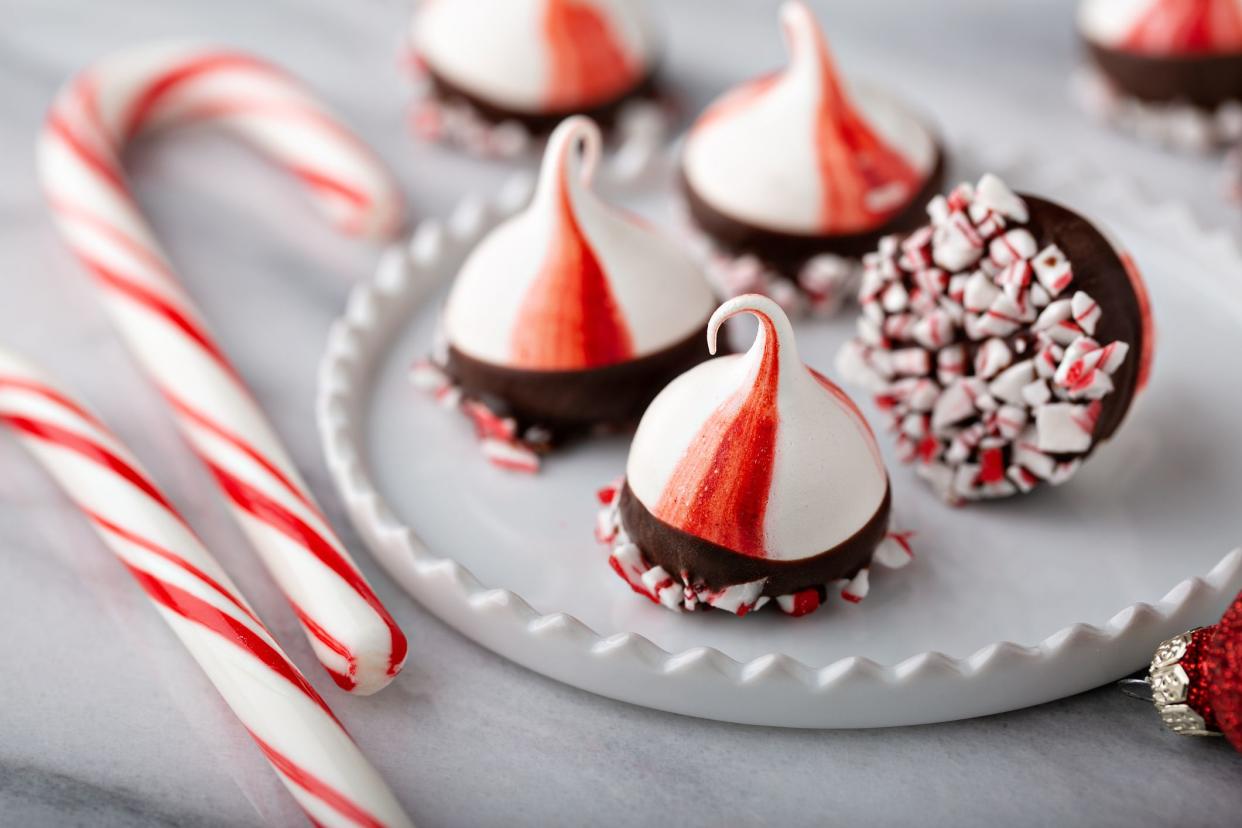 Peppermint meringue kisses dipped in dark chocolate, festive cookies for Christmas