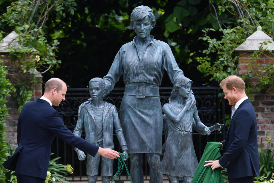 Britain's Prince William, Duke of Cambridge (L) and Britain's Prince Harry, Duke of Sussex unveil a statue of their mother, Princess Diana at The Sunken Garden in Kensington Palace, London on July 1, 2021, which would have been her 60th birthday. - Princes William and Harry set aside their differences on Thursday to unveil a new statue of their mother, Princess Diana, on what would have been her 60th birthday. (Photo by Dominic Lipinski / POOL / AFP) (Photo by DOMINIC LIPINSKI/POOL/AFP via Getty Images)