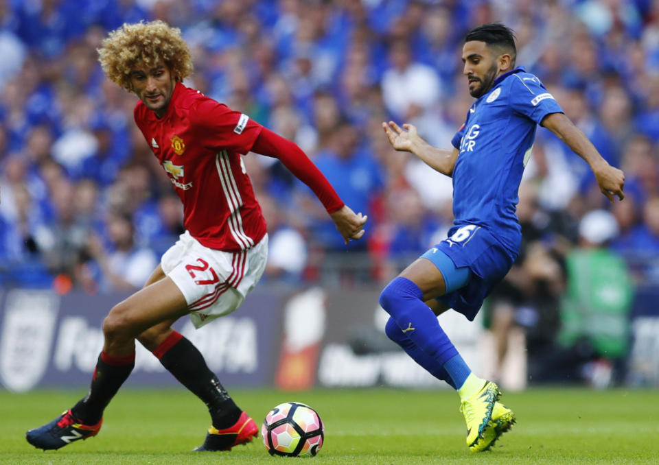 Football Soccer Britain - Leicester City v Manchester United - FA Community Shield - Wembley Stadium - 7/8/16 Manchester United's Marouane Fellaini in action with Leicester City's Riyad Mahrez Reuters / Eddie Keogh Livepic EDITORIAL USE ONLY. No use with unauthorized audio, video, data, fixture lists, club/league logos or "live" services. Online in-match use limited to 45 images, no video emulation. No use in betting, games or single club/league/player publications. Please contact your account representative for further details.