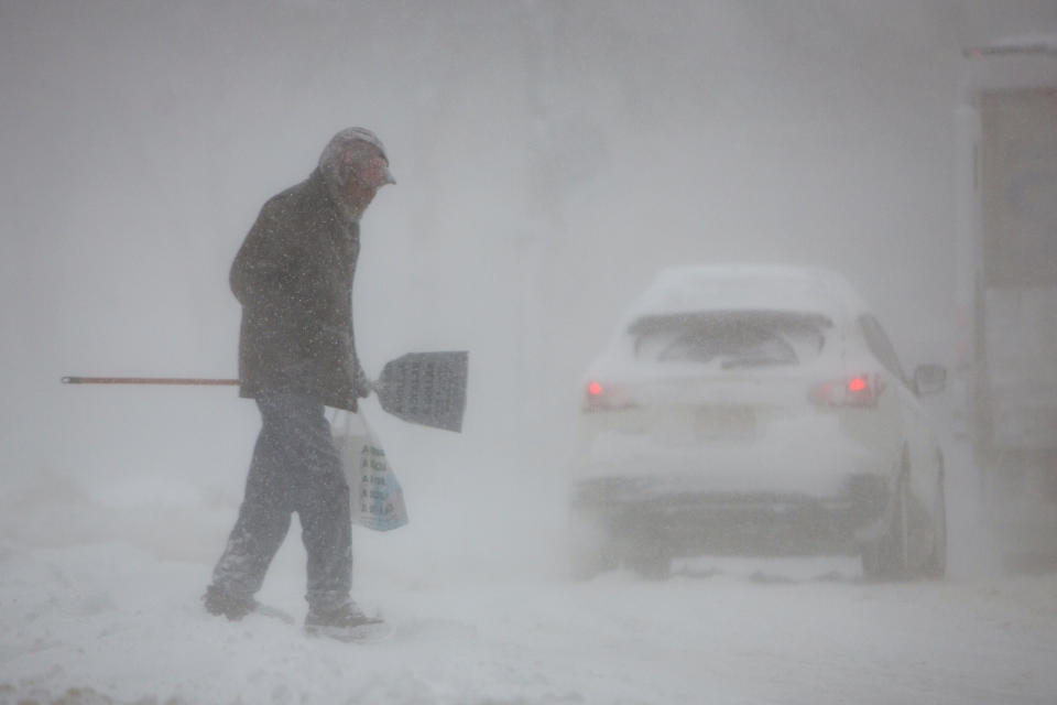 A man crosses a street in whiteout conditions during a winter storm in Buffalo, N.Y, on Jan. 30, 2019. (Photo: Lindsay Dedario/Reuters)