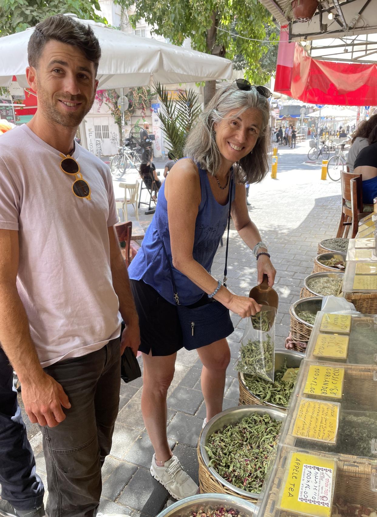 Alec Burkin shops in Israel last year with his mother, Alice Braunstein of Narragansett.