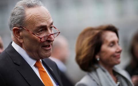 Chuck Schumer and Nancy Pelosi speak to the media as they depart after the meeting at the White House - Credit: CARLOS BARRIA/REUTERS