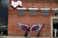 A man walks past the Lyft Driver Hub in Los Angeles, California, U.S., March 20, 2019. REUTERS/Lucy Nicholson