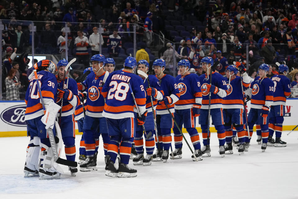 New York Islanders goaltender Ilya Sorokin (30) celebrates with teammates after an NHL hockey game against the Philadelphia Flyers on Wednesday, Nov. 22, 2023, in Elmont, N.Y. (AP Photo/Frank Franklin II)