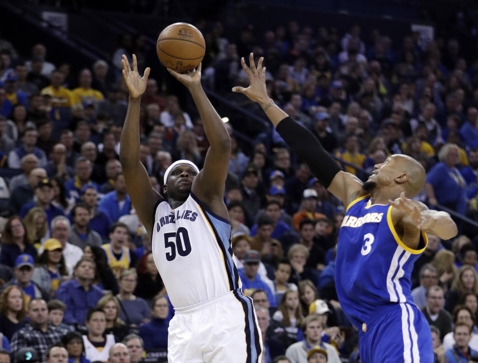 Memphis Grizzlies' Zach Randolph (50) shoots over Golden State Warriors' David West (3) during the first half of an NBA basketball game Sunday, March 26, 2017, in Oakland, Calif. (AP Photo/Marcio Jose Sanchez)