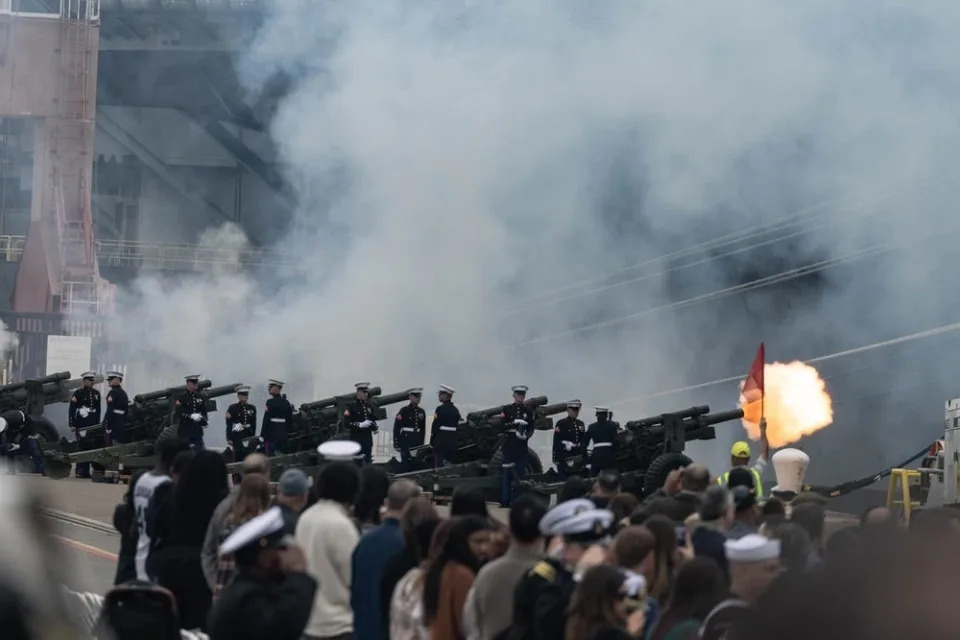 US Marines fire a 21-gun salute during the expeditionary sea base USS John L. Canley commissioning ceremony