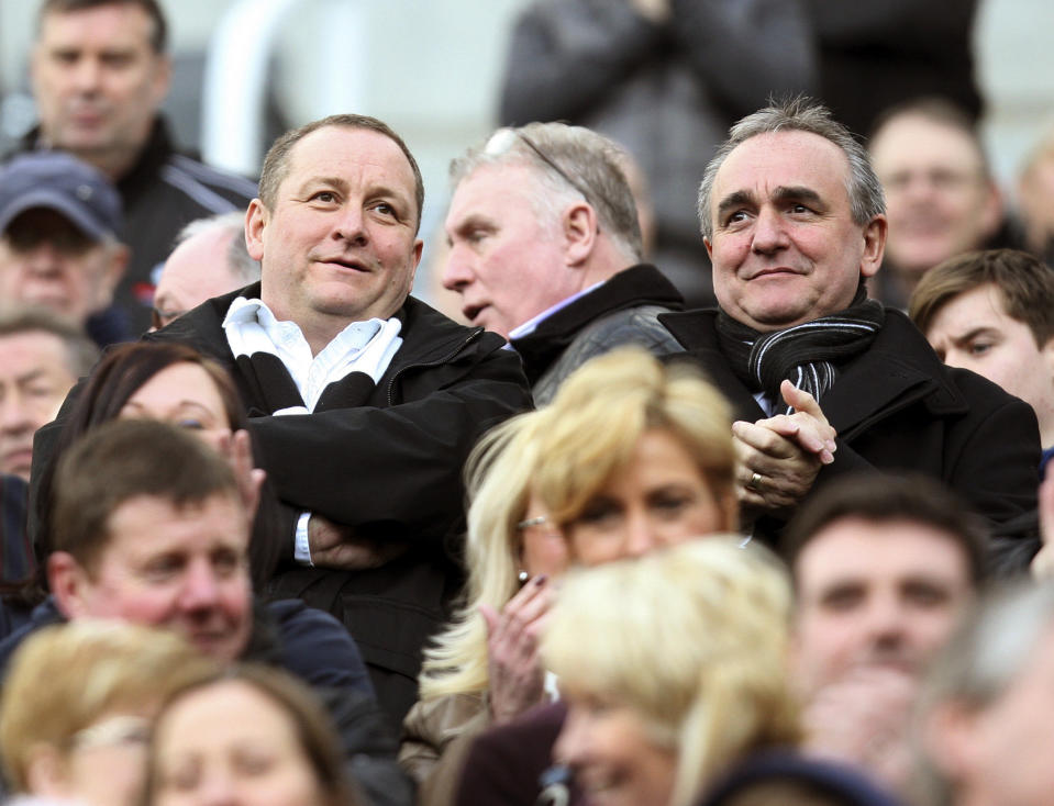 FILE - In this Saturday, Feb. 25, 2012 file photo, Newcastle United's owner Mike Ashley, left, and Chief Executive Derek Llambias, right, in the stands ahead of the English Premier League soccer match between Newcastle United and Wolverhampton Wanderers at the Sports Direct Arena, in Newcastle, England. English Premier League club Newcastle was taken over by Saudi Arabia's sovereign wealth fund on Thursday, Oct. 7, 2021 after a protracted takeover. The takeover by the Saudi Public Investment Fund initially collapsed last year over concerns about how much control the kingdom's leadership would have in the running of Newcastle amid concerns about Saudi human rights abuses and the pirating of sports rights. (AP Photo/Scott Heppell, File)