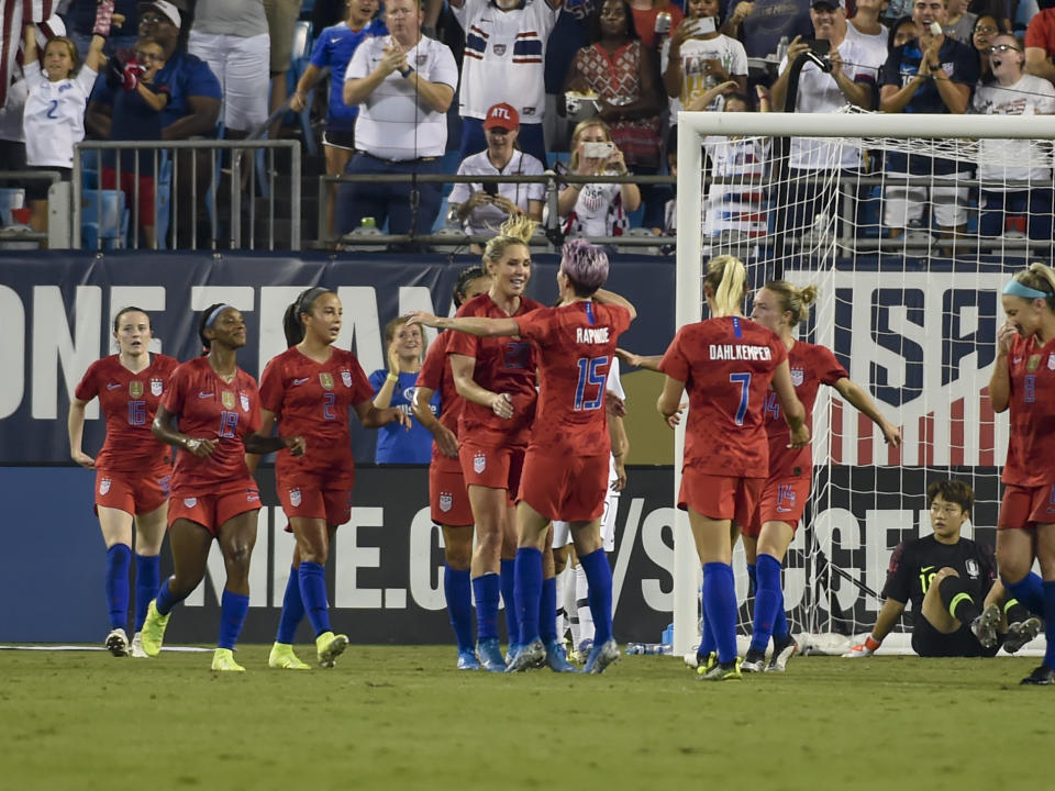 United States' Allie Long celebrates with Megan Rapinoe (15) after scoring against South Korea during the first half of a soccer match Thursday, Oct. 3, 2019, in Charlotte, N.C. (AP Photo/Mike McCarn)