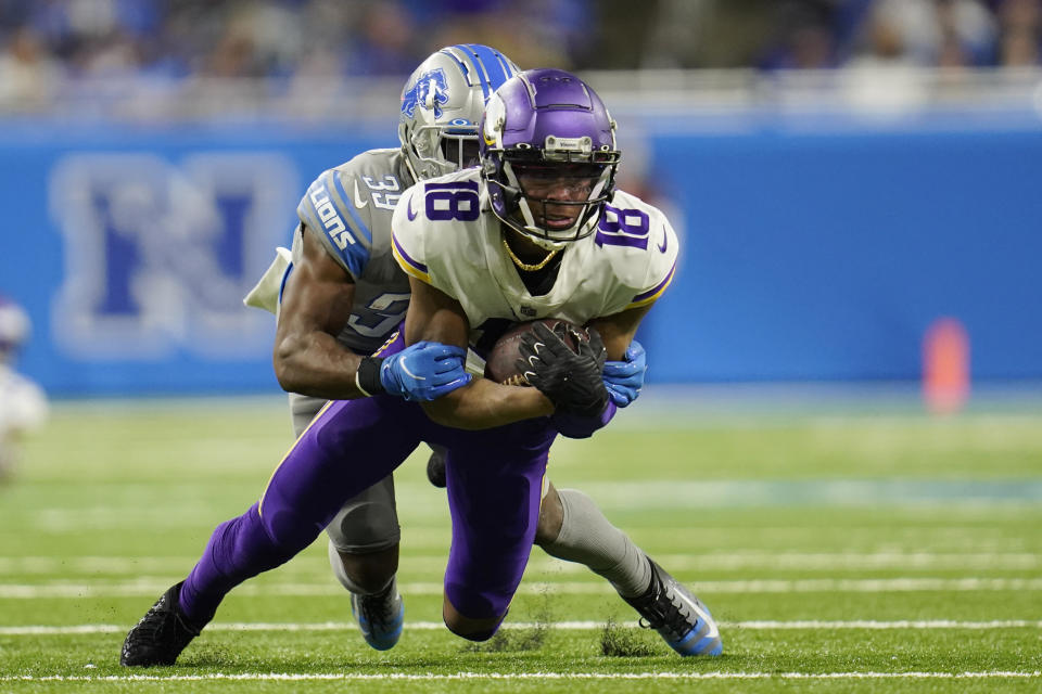 Minnesota Vikings wide receiver Justin Jefferson (18) is tackled by Detroit Lions cornerback Jerry Jacobs (39) during the second half of an NFL football game, Sunday, Dec. 5, 2021, in Detroit. (AP Photo/Paul Sancya)