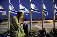 <p>A man reacts next to a portrait of former Israeli President Shimon Peres, as he lies in state at the Knesset plaza, the Israeli parliament, in Jerusalem on Sept. 29, 2016. (REUTERS/Ammar Awad)</p>