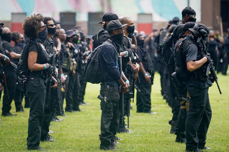 Members and supporters of an all-Black militia group called NFAC hold an armed rally in Louisville