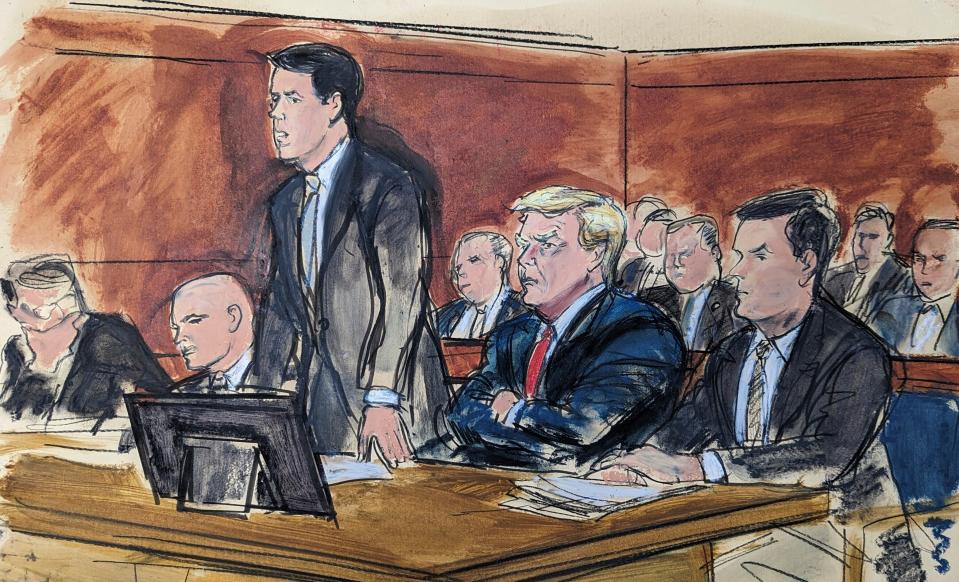 In this courtroom sketch, attorney Todd Blanche stands as he enters a plea of not guilty on behalf of former President Donald Trump, second from right, in federal court June 13 in Miami. From left are Stanley Woodward, Walt Nauta, Blanche, Trump and Chris Kise.