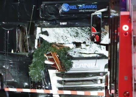 Parts of a Christmas market decoration stick in the windscreen of a truck following an accident with the truck on Breitscheidplatz square near the fashionable Kurfuerstendamm avenue in the west of Berlin, Germany, December 19, 2016. REUTERS/Fabrizio Bensch