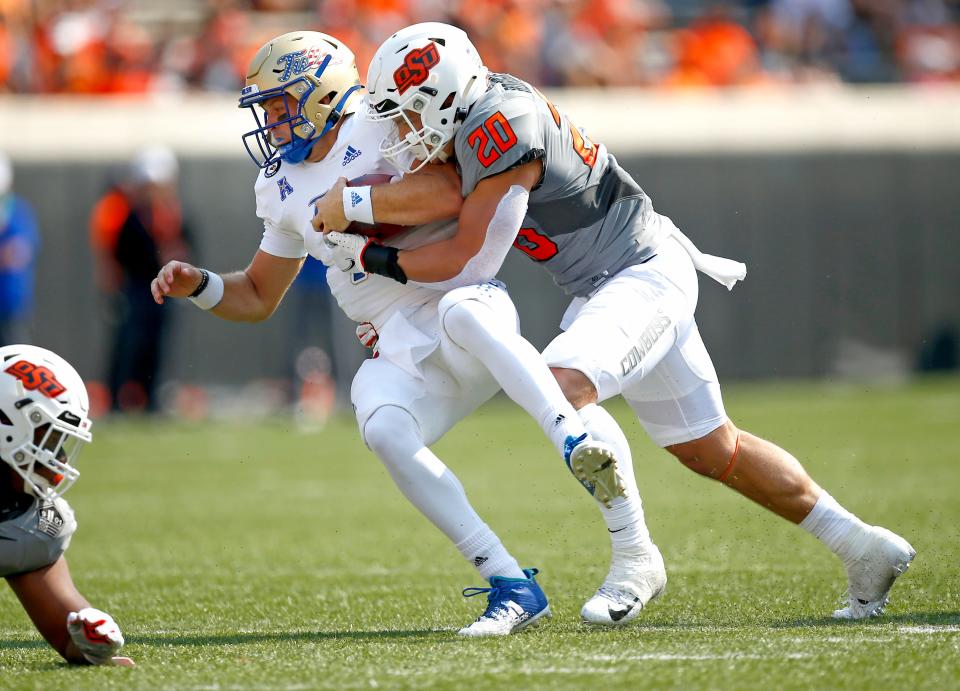 Oklahoma State linebacker Malcolm Rodriguez (20) will take part in his fifth Bedlam matchup on Saturday.