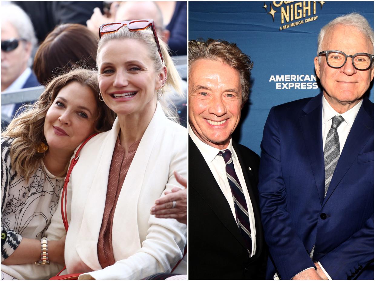 Drew Barrymore leaning her head on Cameron Diaz next to Martin Short and Steve Martin smiling.