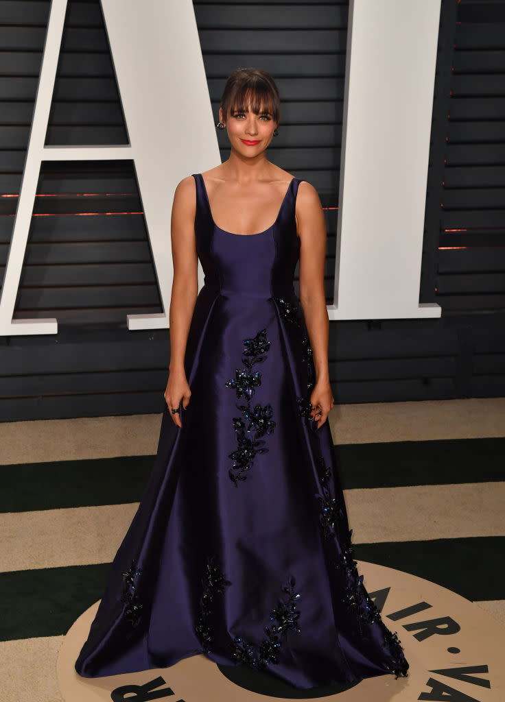 <p>The actress celebrated wore a long, navy blue satin Dauphin number to the Vanity Fair Oscar Party. (Photo: Getty Images) </p>