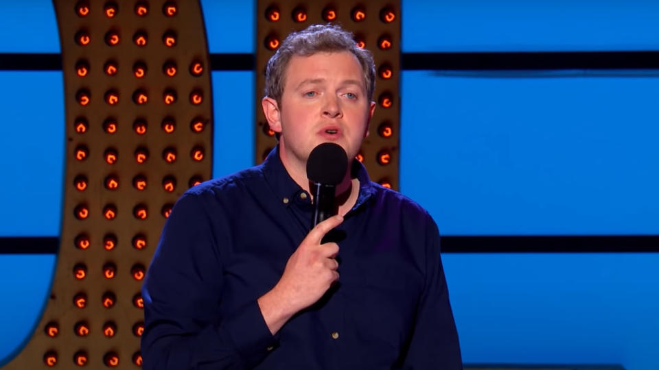 Miles Jupp performing standup