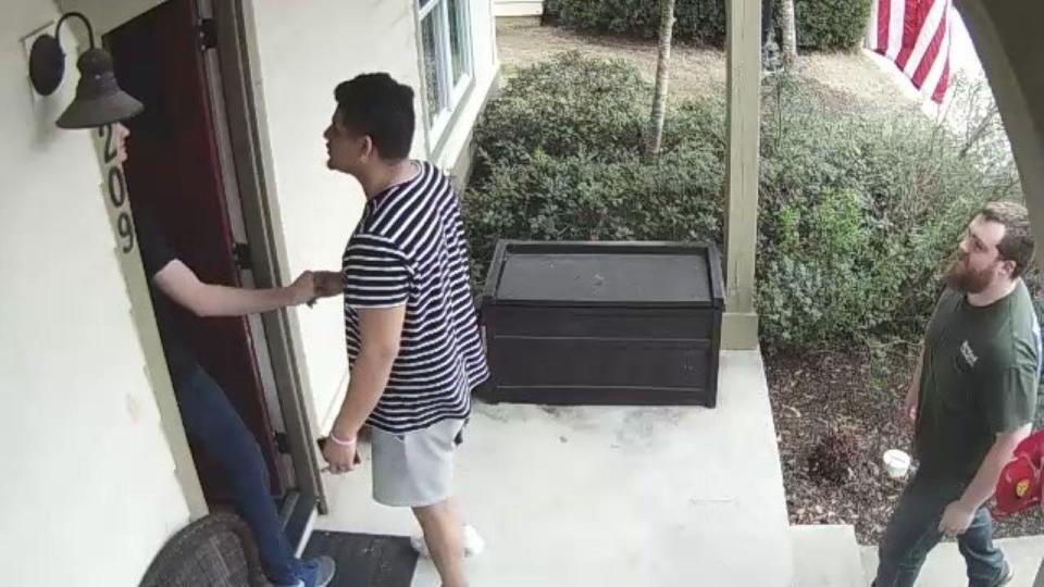 Security footage from Nick and Jackie's front porch proved to be a major turn in the case. Recorded just two days before the attack, it shows Nick Shaughnessy, left, greeting two men at the front door. / Credit: Travis County Sheriff's Office