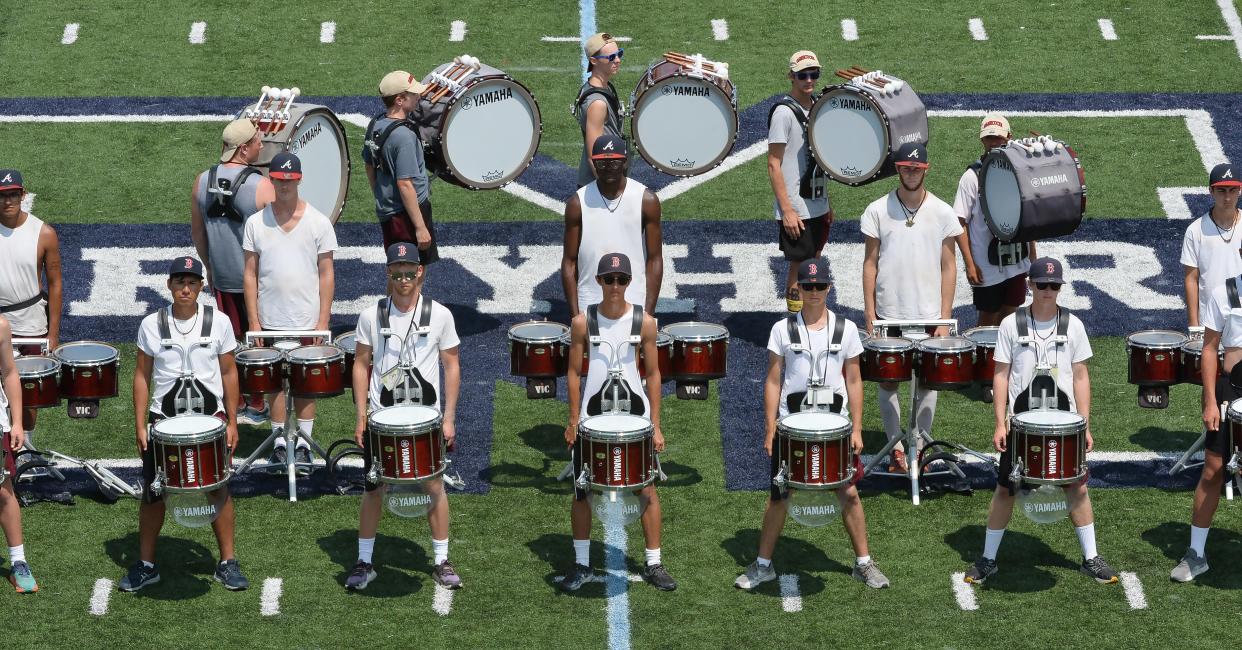 Members of The Cadets drum corps get set to perform during a clinic for high school band members at Mercyhurst University in June.