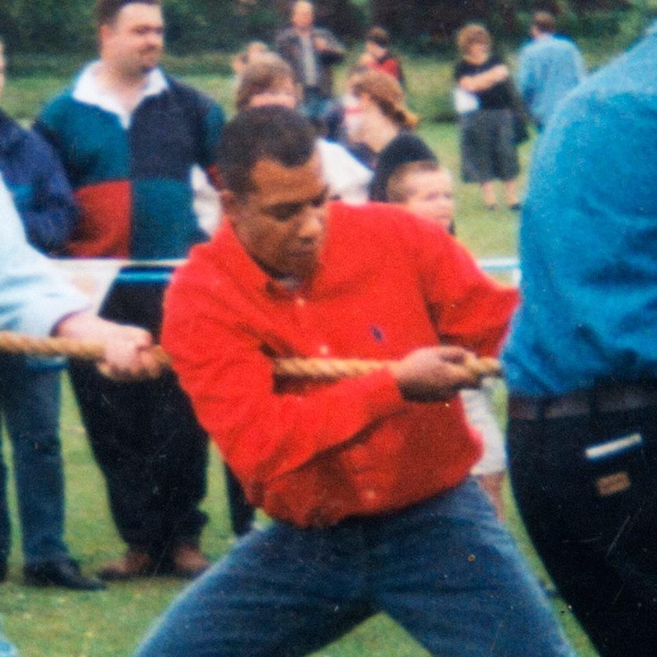 Westminster attacker Adrian Ajao (aka Khalid Masood) - red sweater - who lived in the village of Northiam takes part in a village fete tug-of-war pre-2003 - Credit:  Julian Simmonds