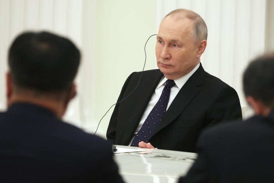 Russian President Vladimir Putin, center, listens to the Chinese Communist Party's foreign policy chief Wang Yi during their meeting at the Kremlin in Moscow, Russia, Wednesday, Feb. 22, 2023. (Anton Novoderezhkin, Sputnik, Kremlin Pool Photo via AP)