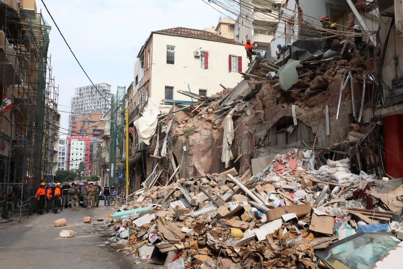 Rescue team search through rubble of damaged buildings due to the massive explosion at Beirut's port area