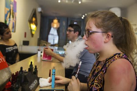 A customer tries different e-cigarette flavors at the Henley Vaporium in New York, June 23, 2015. REUTERS/Lucas Jackson