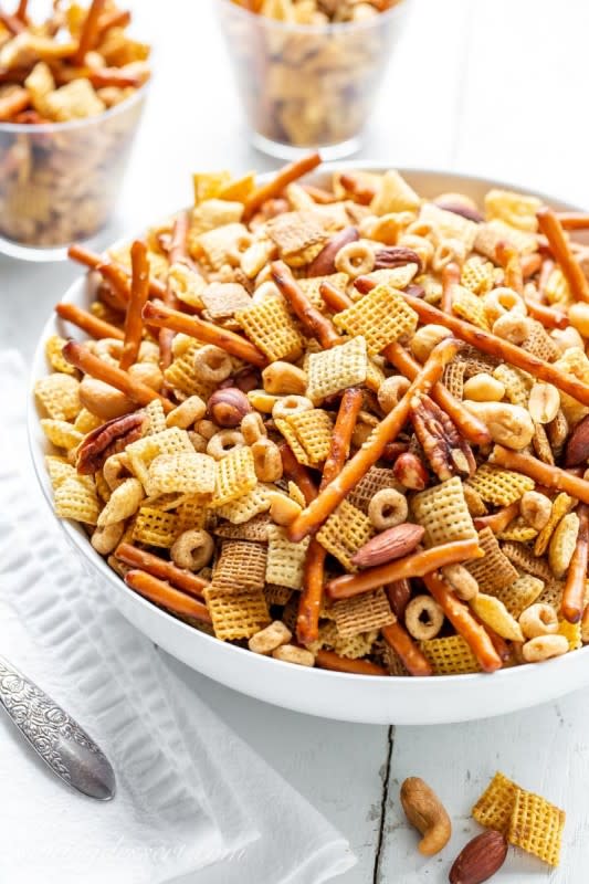 <p>Saving Room for Dessert</p><p>Nothing goes better with a good football game than this Chex Mix recipe loaded with nuts, pretzels and cereal that’s been baked with butter and delicious savory flavors.</p><p><a href="https://www.savingdessert.com/nuts-bolts-party-chex-mix-recipes/" rel="nofollow noopener" target="_blank" data-ylk="slk:Get the Recipe;elm:context_link;itc:0;sec:content-canvas" class="link ">Get the Recipe</a></p>
