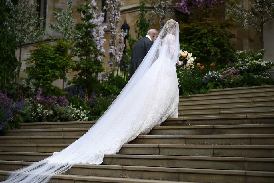A sweeping moment of the bride's gown and veil