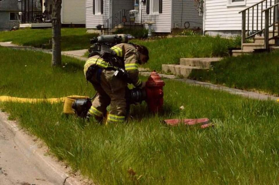 Firefighters battle a blaze in the 100 block of Argyle St. in Jackson Friday. (Courtesy Michigan Fire Alerts)