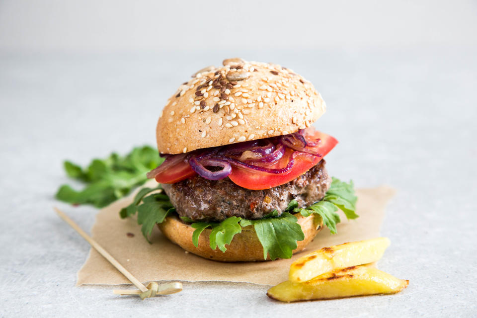 Craft homemade beef burger and french fries. Light background, copy space