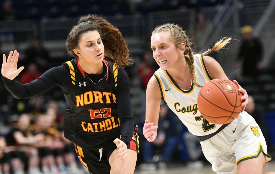 Blackhawk's Kassie Potts drives to the hoop as North Catholic's Kaitlyn Tavella defends during Saturday's WPIAL Class 4A championship game at the Petersen Events Center in Pittsburgh.