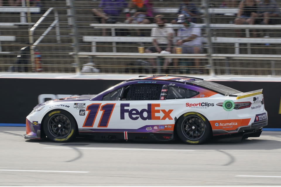 Denny Hamlin (11) drives during a NASCAR Cup Series auto race at Texas Motor Speedway in Fort Worth, Texas, Sunday, Sept. 25, 2022. (AP Photo/Larry Papke)