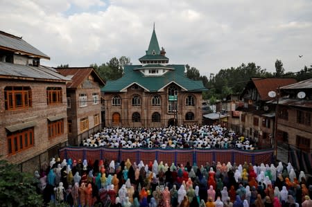 Kashmiris attend Eid-al-Adha prayers at a mosque during restrictions after the scrapping of the special constitutional status for Kashmir by the Indian government, in Srinagar