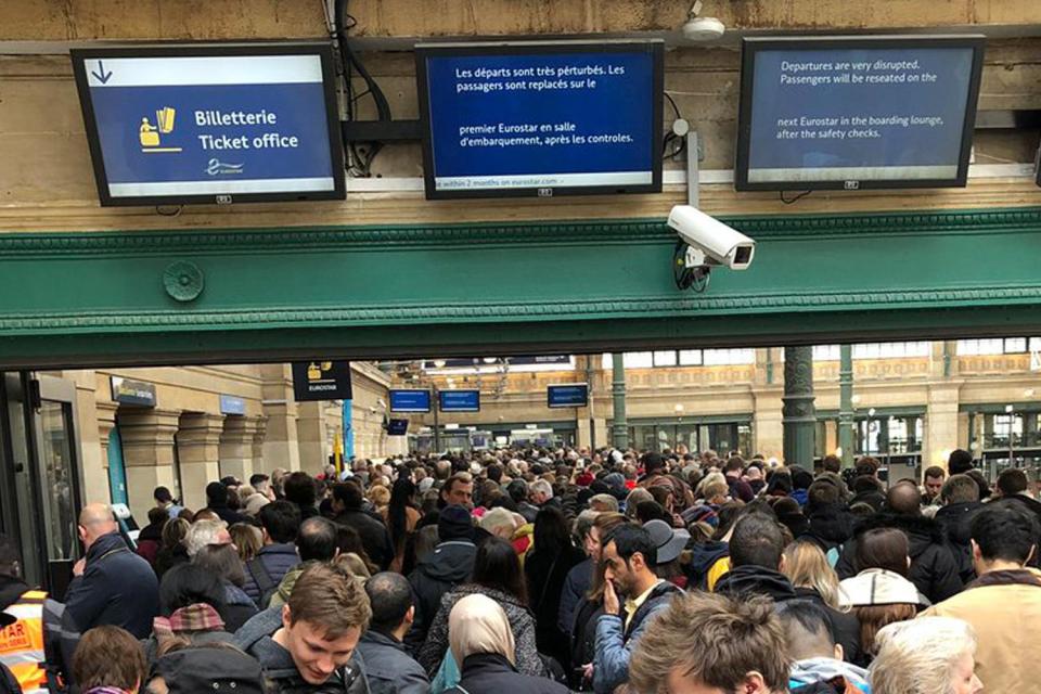 Customers queue to board trains yesterday (Tom Halverson)