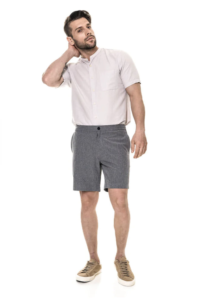 A man stands hand on head wearing the OMNIFLEX&#x002122; All Day Shorts