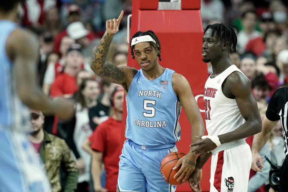 North Carolina forward Armando Bacot (5) reacts during the first half of an NCAA college basketball game against North Carolina State in Raleigh, N.C., Saturday, Feb. 26, 2022.