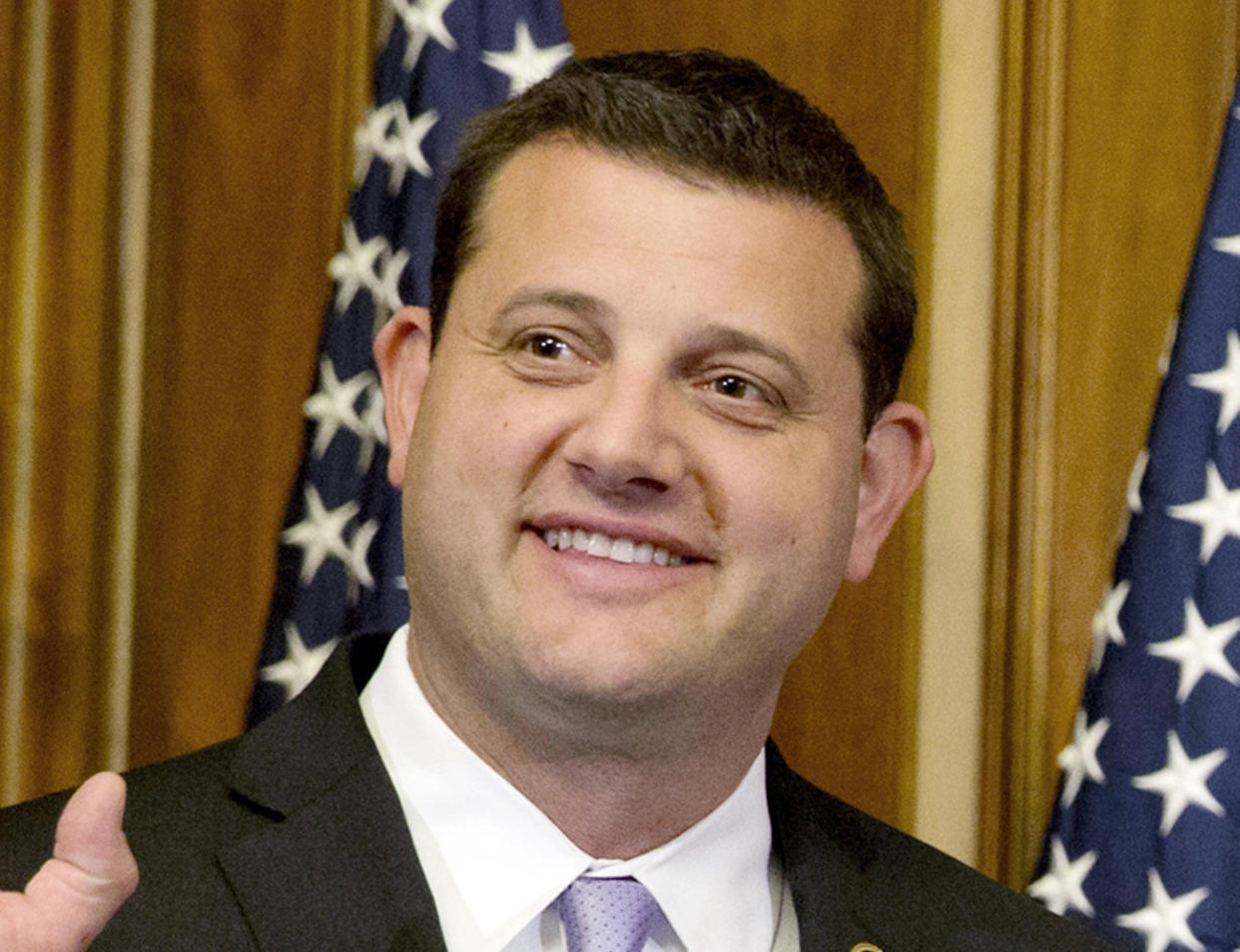 In this Jan. 6, 2015 file photo, Rep. David Valadao, R-Calif., poses during a ceremonial re-enactment of his swearing-in ceremony in the Rayburn Room on Capitol Hill in Washington. (Jacquelyn Martin/AP Photo)