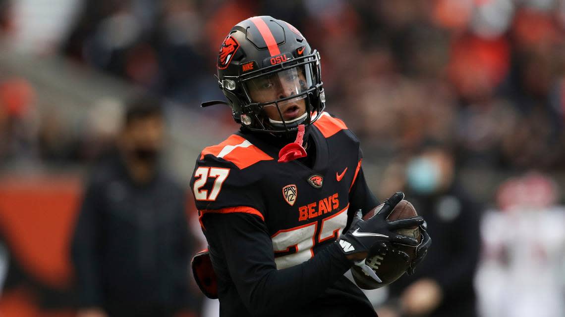 Oregon State wide receiver Rweha Munyagi Jr. (27) warms up prior to an NCAA college football game against Utah on Saturday, Oct. 23, 2021, in Corvallis, Ore. Oregon State won 42-34. (AP Photo/Amanda Loman)