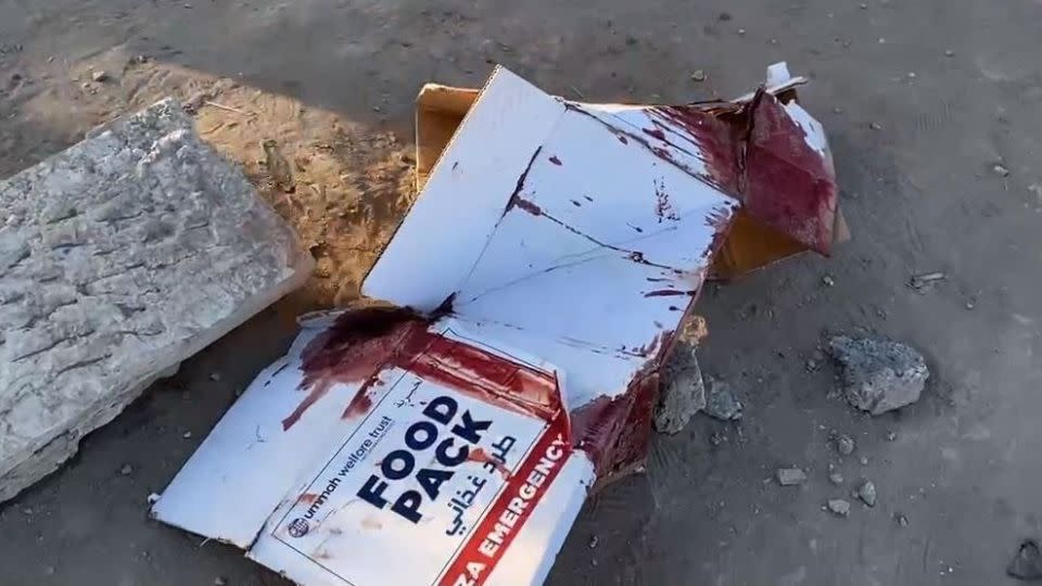 A bloodied aid box found at the scene with the writing "Ummah Welfare Trust" provided a clue as to one of the aid organizations behind the delivery on February 29. - Ummah Welfare Trust