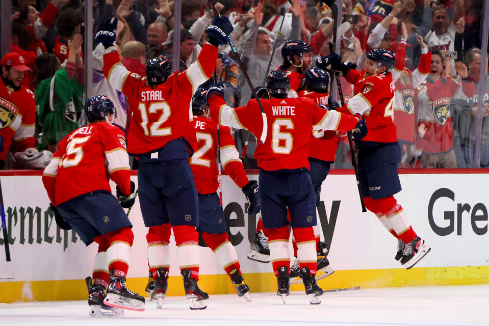 SUNRISE, FLORIDA - JUNE 08:  Carter Verhaeghe #23 of the Florida Panthers is congratulated by his teammates after scoring the game-winning goal against the Vegas Golden Knights during  in Game Three of the 2023 NHL Stanley Cup Final at FLA Live Arena on June 08, 2023 in Sunrise, Florida. (Photo by Bruce Bennett/Getty Images)