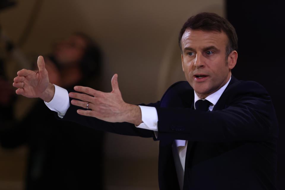 French President Emmanuel Macron gestures during his first prime-time news conference to announce his top priorities for the year as he seeks to revitalize his presidency, vowing to focus on "results" despite not having a majority in parliament, Tuesday, Jan. 16, 2024 at the Elysee Palace in Paris. (AP Photo/Aurelien Morissard)