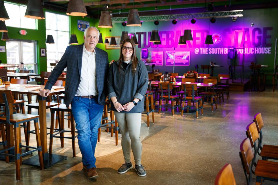 Mark Tarner, left, owner of South Bend Chocolate Company, and his director of operations, Kristina Tressler, pose for a portrait together at South Bend Public House on Tuesday, Sept. 10, 2024, before the restaurant's opening day on Thursday in South Bend.